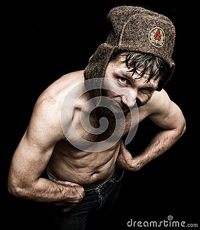 Dark portrait of scary evil sinister bearded man with smirk, makes various hand's signs and expresses different emotions Stock Photo