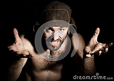 Dark portrait of scary evil sinister bearded man with smirk, makes various hand's signs and expresses different emotions Stock Photo