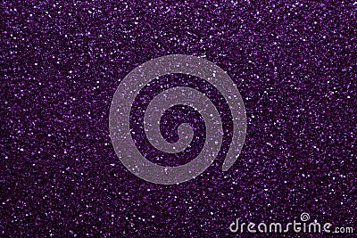 Dark purple sparkling background from small sequins, closeup. Brilliant shiny backdrop from textile. Stock Photo