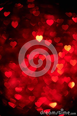 Dark red color heart bokeh background photo. Abstract holiday, celebration backdrop. Stock Photo