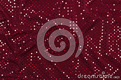 Dark red fabric with sparkling metallic dots design Stock Photo