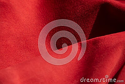 Dark red matte background of suede fabric, closeup. Velvet texture of seamless wine leather. Felt material macro. Stock Photo