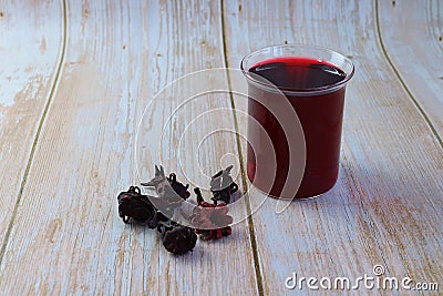 dark red-purple coloured juice. The Burkinabes, Senegalese, and Ivorians call it bissap Stock Photo