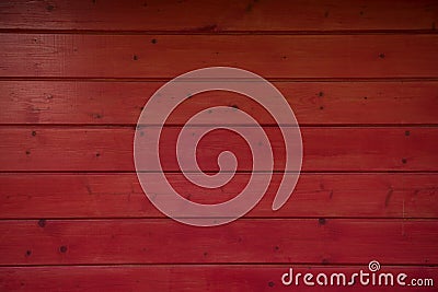 Dark Red wooden wall as background. Red texture. Wooden red fence. Red planks. Stock Photo