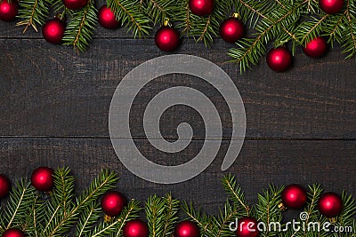 Dark rustic wood table flatlay - Christmas background with red ball ornament decoration and fir branch frame. Top view with free Stock Photo