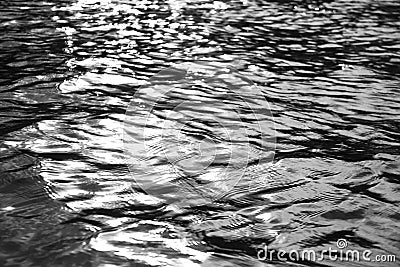 Dark shimmering water ripples of the lake Stock Photo