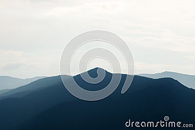 Dark silhouettes of mountains at sunset. Mountain landscape Stock Photo