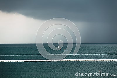 Dark sky cloud rain strom in the sea Stock Photo