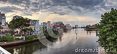 Dark sky over the colorful shops Editorial Stock Photo