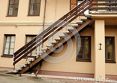 Dark stairway up on beige wall european architecture building Stock Photo