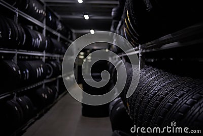 Variety of tyres at busy warehouse Stock Photo