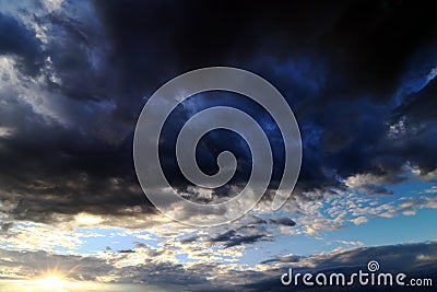 Dark thunderclouds in the evening sky Stock Photo