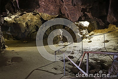 Dark Tunnel Cave has no body. Tourist route, tours, adventures and interesting places. inside ancient crystal formations, stones, Stock Photo