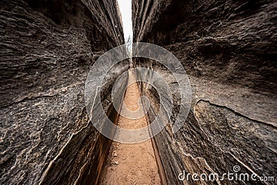 Dark Walls Run Parallel Along Narrow Slot Canyon Stock Photo