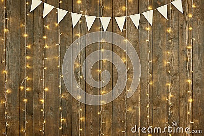 Dark wood background with lights and flags, abstract holiday backdrop, copy space for text Stock Photo