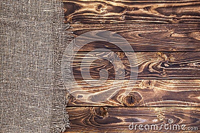 Dark wooden background with burlap, rustic wood and sack Stock Photo