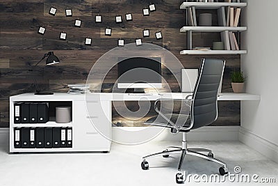 Dark wooden home office, black chair, side Stock Photo