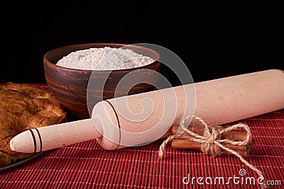 On a dark wooden table american apricot pie, ingredients and tools on black background Stock Photo