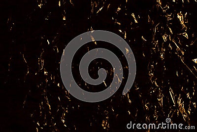 Dark yellow and black abstract background, golden shining metallic surface, crumpled gold metal shiny backdrop design Stock Photo