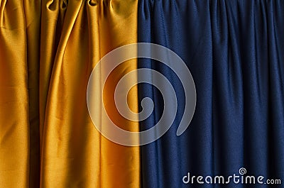 Dark yellow and blue draped curtains.Empty space for design Stock Photo