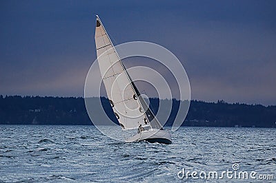 Darkened skies, rough seas, heading for home. Editorial Stock Photo