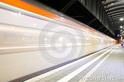 Darmstadt, Hessen, Germany - 16 Jan 2020: train in motion at main station, platform view level at night Editorial Stock Photo