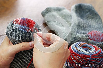 Darning socks Stock Photo