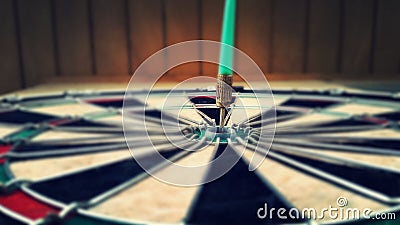 Dart arrow hitting red central target Stock Photo