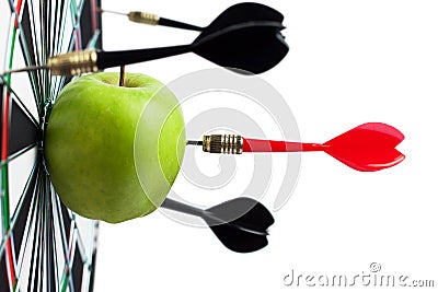 Dart hit green apple Stock Photo