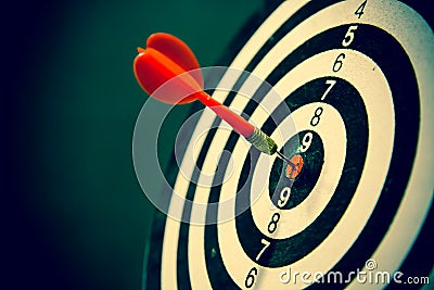 Dart hits center Bullseye is a target and goal. Stock Photo