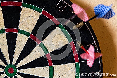 Dartboard with Steel darts outside Stock Photo