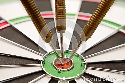 Darts in dartboard Stock Photo