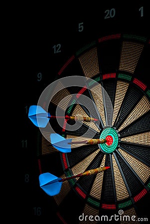 Darts stuck in an electronic dartboard Stock Photo