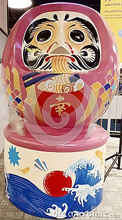 DARUMA, a doll that brings good luck in Japan. DARUMA means steadfastness and perseverance. Editorial Stock Photo