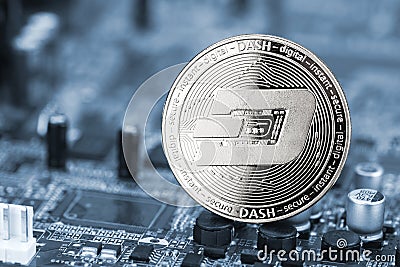 Dash crypto currency silver coin mining computer background Editorial Stock Photo