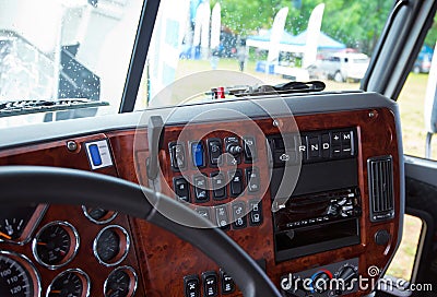 Dashboard console in interior of modern truck inlaid wood Stock Photo