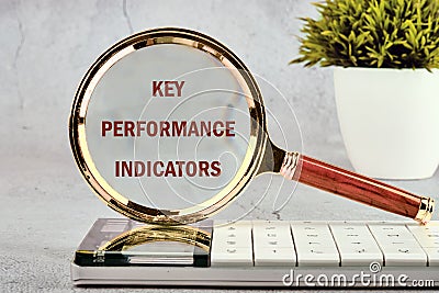 Data analytics automated with AI technology. KEY PERFORMANCE INDICATORS (KPIs) on a gray background standing on Stock Photo