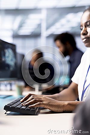 Data center worker implementing AI driven predictive analytics solutions Stock Photo