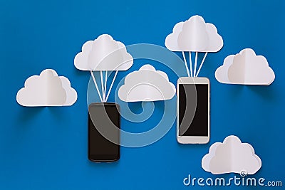 Data communications and cloud computing network concept. Smart phone flying on paper cloud. Stock Photo