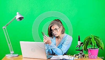 Data and information. Business communication. chemist biologist with microscope on table. woman work in office on laptop Stock Photo