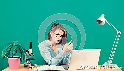 Data and information. Business communication. chemist biologist with microscope on table. woman work in office on laptop Stock Photo
