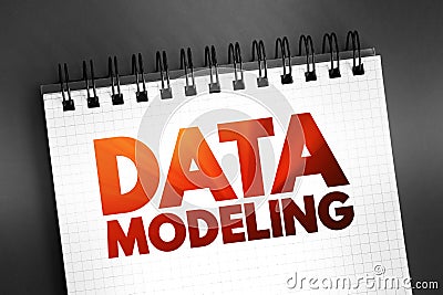 Data modeling - process of creating a data model for an information system by applying certain formal techniques, text on notepad Stock Photo