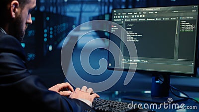 Database admin checking mainframe system on computer Stock Photo