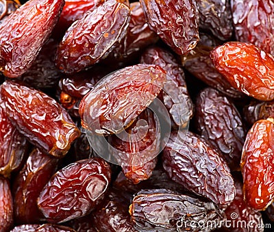 Date fruits. Dates fruit close up design background. Heap of Medjool dates close up, macro shot Stock Photo