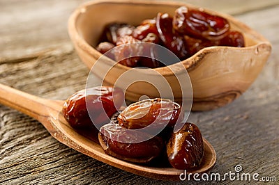 Date over wood spoon Stock Photo