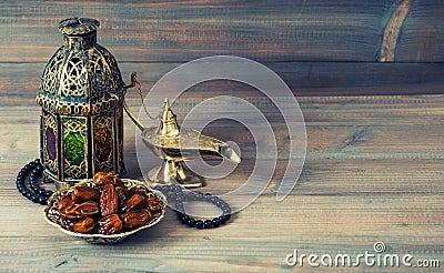 Dates, arabian lantern and rosary. Islamic holiday Stock Photo