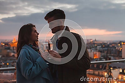 dating, young couple drinking champagne in Paris by night, France Stock Photo