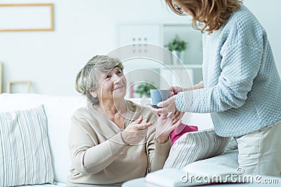 Daughter caring about elder mother Stock Photo