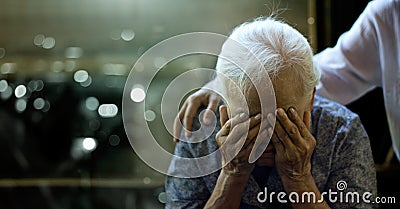 The daughter is comforting an elderly woman who is a mother sadness with Alzheimer`s disease and amnesia, Memory loss due to Stock Photo