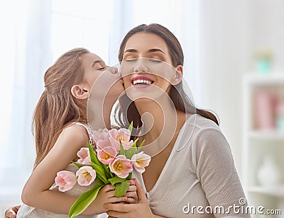 Daughter congratulates mom Stock Photo